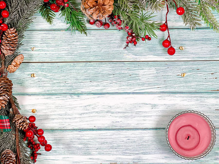 Christmas festive background of pine branches, gifts and toys on vintage boards. The concept of a...