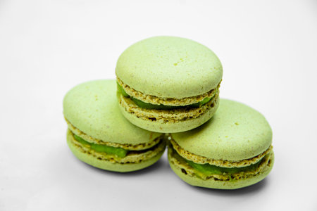 Pistachio macarone cake on a white background isolated close-up. Pleasant sweets.の写真素材