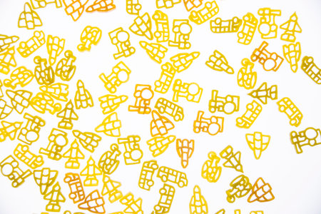 Curly vermicelli for children in the form of toys on a white background. Health food.の写真素材