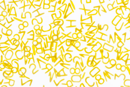 Curly vermicelli for children in the form of letters on a white background. Health food.の写真素材
