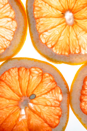 Lemon and grapefruit slices on a white background on the lumen. The concept of citrus mood.の写真素材