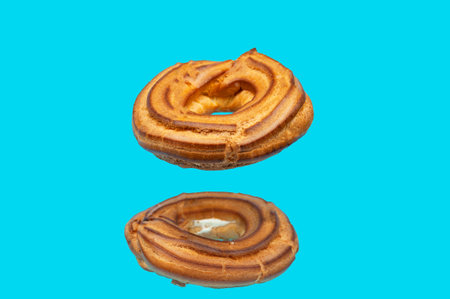 Pastry rings with cream in levitation. The concept of confectionery products.