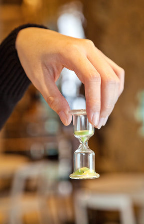 hand hold the hourglass