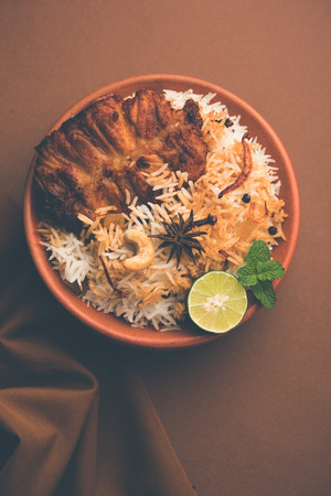 Authentic Fish Biryani served in a white plate over white background, selective focusの写真素材