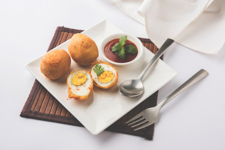 Tasty Egg Pakora or Pakoda served with tomato ketchupの写真素材