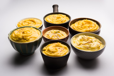 Shrikhand & Amrakhand served in different size bowl in group. Selective focusの写真素材