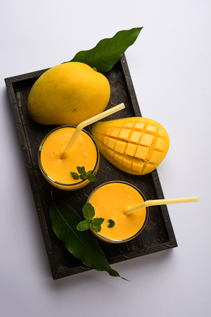 Mango Lassi, Indian popular summer drink in a terracotta glass, selective focusの写真素材