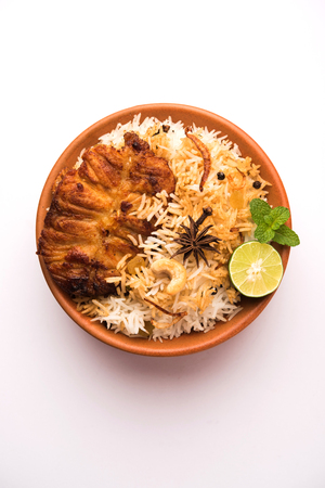 Authentic Fish Biryani served in a white plate over white background, selective focusの写真素材