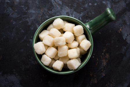 Chena Murki is indian sweet food served in ceramic bowl over moody background. selective focusの写真素材