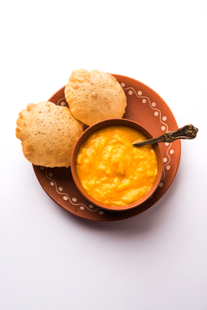 Aam Ras Puri OR Alphonso  Mango pulp with fried Poori, selective focusの写真素材