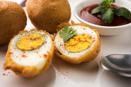 Tasty Egg Pakora or Pakoda served with tomato ketchupの写真素材