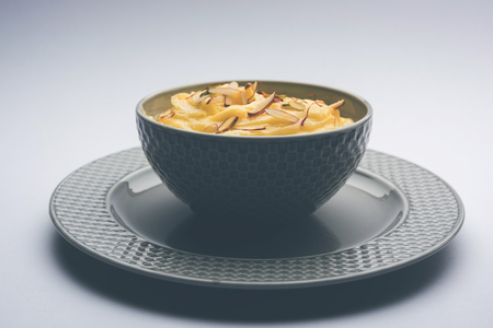 Shrikhand OR Srikhand is an Indian dessert made of strained yogurt, garnished with dry fruits and saffron.の写真素材