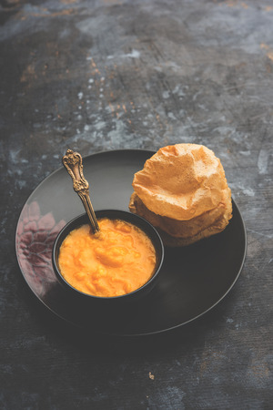 Aam Ras Puri OR Alphonso  Mango pulp with fried Poori, selective focusの写真素材