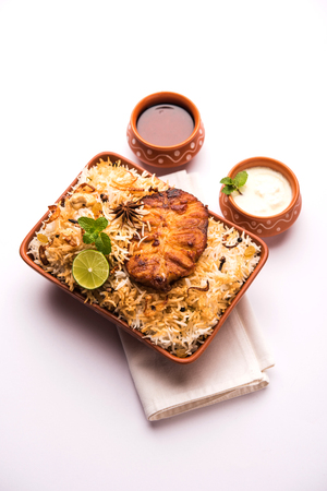 Authentic Fish Biryani served in a white plate over white background, selective focusの写真素材