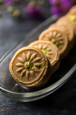 Traditional dumpling momos food from Nepal served with tomato chutney over moody background. Selective focusの写真素材