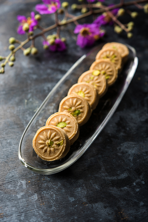 Traditional dumpling momos food from Nepal served with tomato chutney over moody background. Selective focusの写真素材