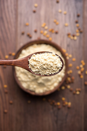 Bowl of chick peas flour or besan powderの写真素材