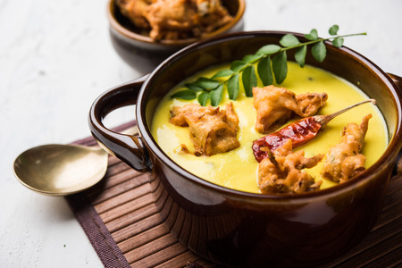 Punjabi Kadhi Pakoda or curry Pakora, Indian cuisine served in a bowl or karahi, selective focusの写真素材