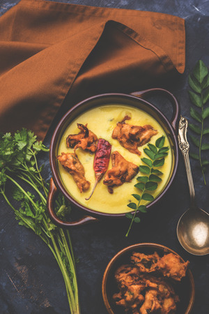 Punjabi Kadhi Pakoda or curry Pakora, Indian cuisine served in a bowl or karahi, selective focusの写真素材