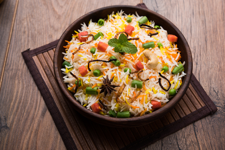 Indian Vegetable Pulav or Biryani made using Basmati Rice, served in a ceramic bowl. selective focusの写真素材