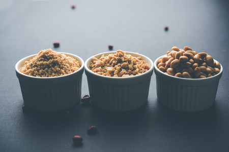 Crushed peanuts or mungfali powder with whole and roasted groundnut. Served in a bowl over moody background. Selective focusの写真素材