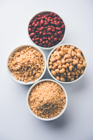 Crushed peanuts or mungfali powder with whole and roasted groundnut. Served in a bowl over moody background. Selective focusの写真素材
