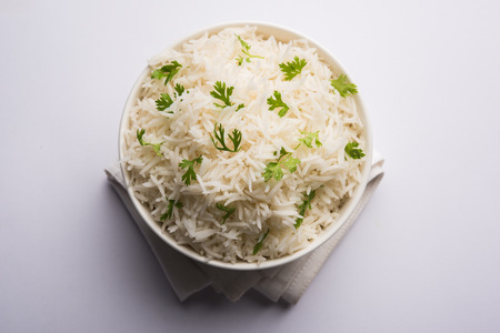Coriander or cilantro Basmati Rice, served in a ceramic or terracotta bowl. It's a popular Indian OR Chinese recipe. Selective focusの写真素材