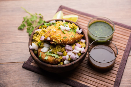 Ragda Pattice is a popular Street food or chat made of potato Patties. served in a steel plate, bowl...