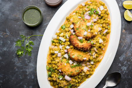 Ragda Pattice is a popular Street food or chat made of potato Patties. served in a steel plate, bowl or ceramic plate with tamarind and cilantro chutneyの写真素材