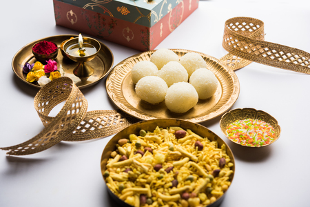 Raksha bandhan Festival : conceptual Rakhi made using plate full of Rasgulla sweet with band. A traditional Indian wrist band which is a symbol of love between Brothers and Sistersの写真素材