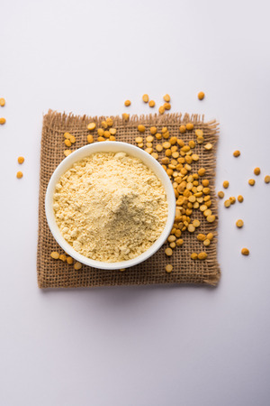 Besan, Gram or chickpea flour or powder is a pulse flour made from a variety of ground chickpea known as Bengal gram. popular ingredient for Pakora/pakoda or bajji snack. Selective focusの写真素材