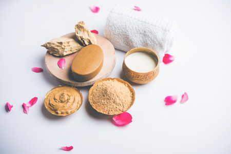 Herbal or Ayurvedic face Pack using Multani mitti, milk etc placed with Soap, towel. Selective focusの写真素材