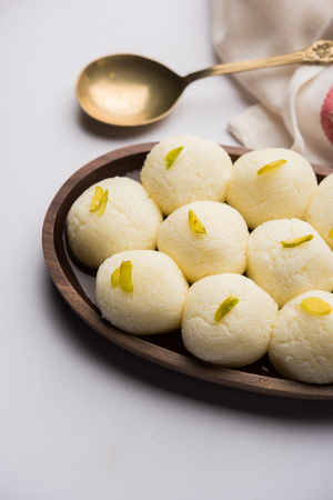 Indian Rasgulla or Rosogulla dessert/sweet served in a bowl. Selective focusの写真素材