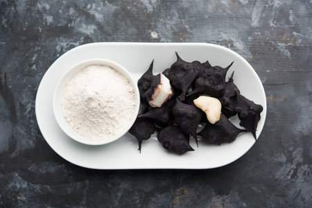 cooked Water chestnut with flour or powder, also known as singada/singara or shingada peeth, selective focusの写真素材