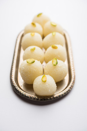 Indian Rasgulla or dry Rosogulla dessert/sweet served in a bowl. selective focusの写真素材