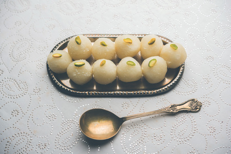 Indian Rasgulla or dry Rosogulla dessert/sweet served in a bowl. selective focusの写真素材