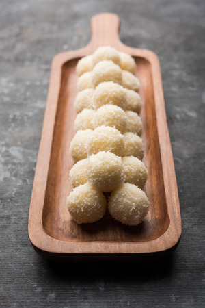 Coconut Sweet Laddoo OR Nariyal Ladduis a Popular Festival food from India. Served over moody background, selective focusの写真素材