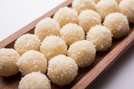 Coconut Sweet Laddoo OR Nariyal Ladduis a Popular Festival food from India. Served over moody background, selective focusの写真素材