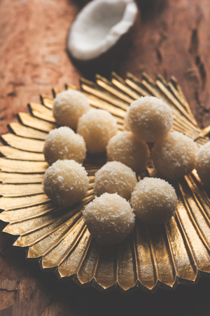 Coconut Sweet Laddoo OR Nariyal Ladduis a Popular Festival food from India. Served over moody background, selective focusの写真素材
