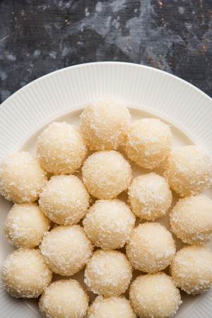Coconut Sweet Laddoo OR Nariyal Ladduis a Popular Festival food from India. Served over moody background, selective focusの写真素材
