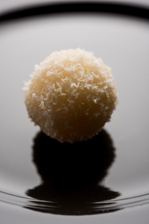 Coconut Sweet Laddoo OR Nariyal Ladduis a Popular Festival food from India. Served over moody background, selective focusの写真素材