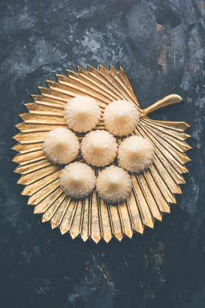 Sweet Modak made using coconut, khoya and sugar. Popular Maharashtrian recipe offered to lord Ganesha in Ganesh Festival. Served in a plate. Selective focusの写真素材