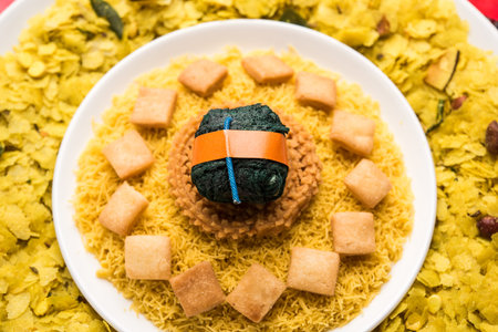 Rangoli or design made using Indian snacks/sweet and firecrackers or patakhe for Diwali festival