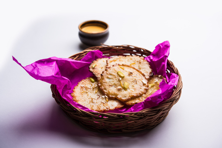 Malpua sweet - Traditional Indian dessert or pancake for festivals, served in plate with rabri/rabdi . selective focusの写真素材