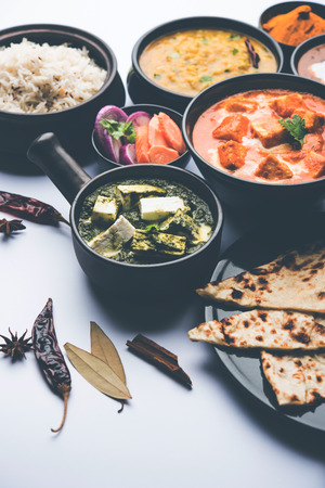 Indian Lunch / Dinner main course food in group includes Paneer Butter Masala, Dal Makhani, Palak Paneer, Roti, Rice etc, Selective focusの写真素材