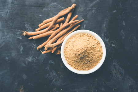 Ashwagandha / Aswaganda OR Indian Ginseng is an Ayurveda medicine in stem and powder form. Isolated on plain background. selective focusの写真素材