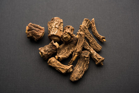 Hemidesmus indicus also known as Ananthamoola or Naruneendi or Nannari in dried steam and powder form. It's a useful Ayurvedic medicine from Indiaの写真素材