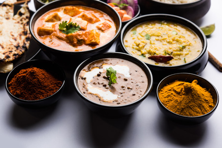 Indian Lunch / Dinner main course food in group includes Paneer Butter Masala, Dal Makhani, Palak Paneer, Roti, Rice etc, Selective focusの写真素材