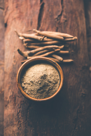 Ashwagandha / Aswaganda OR Indian Ginseng is an Ayurveda medicine in stem and powder form. Isolated on plain background. selective focusの写真素材