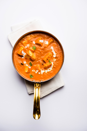 Paneer Butter Masala or Cheese Cottage Curry in serving a bowl or pan, served with or without roti and riceの写真素材